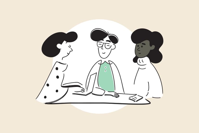 Designers and nonprofit leaders meeting around a boardroom table